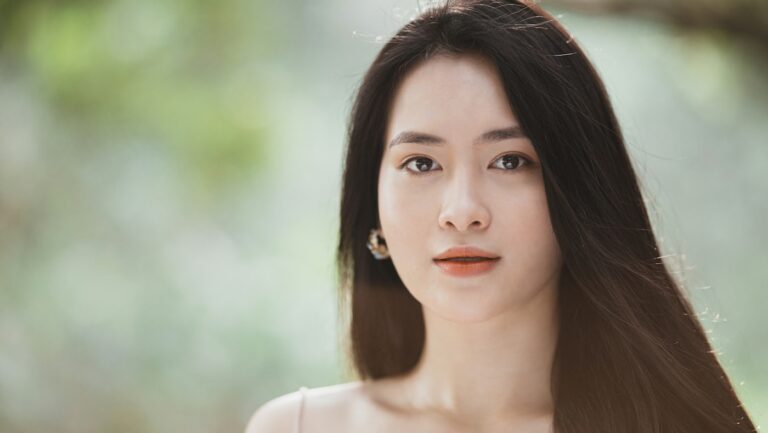 Woman with a dewy, even complexion photographed in soft natural light